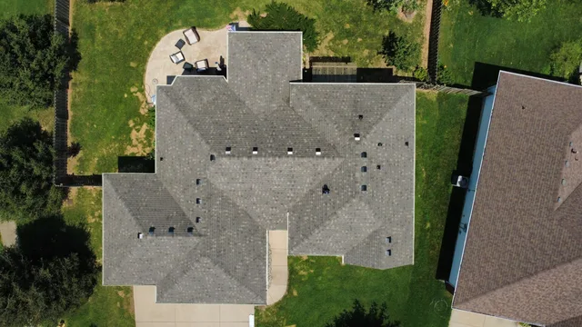 Aerial view of a home with a new grey architectural shingle roof