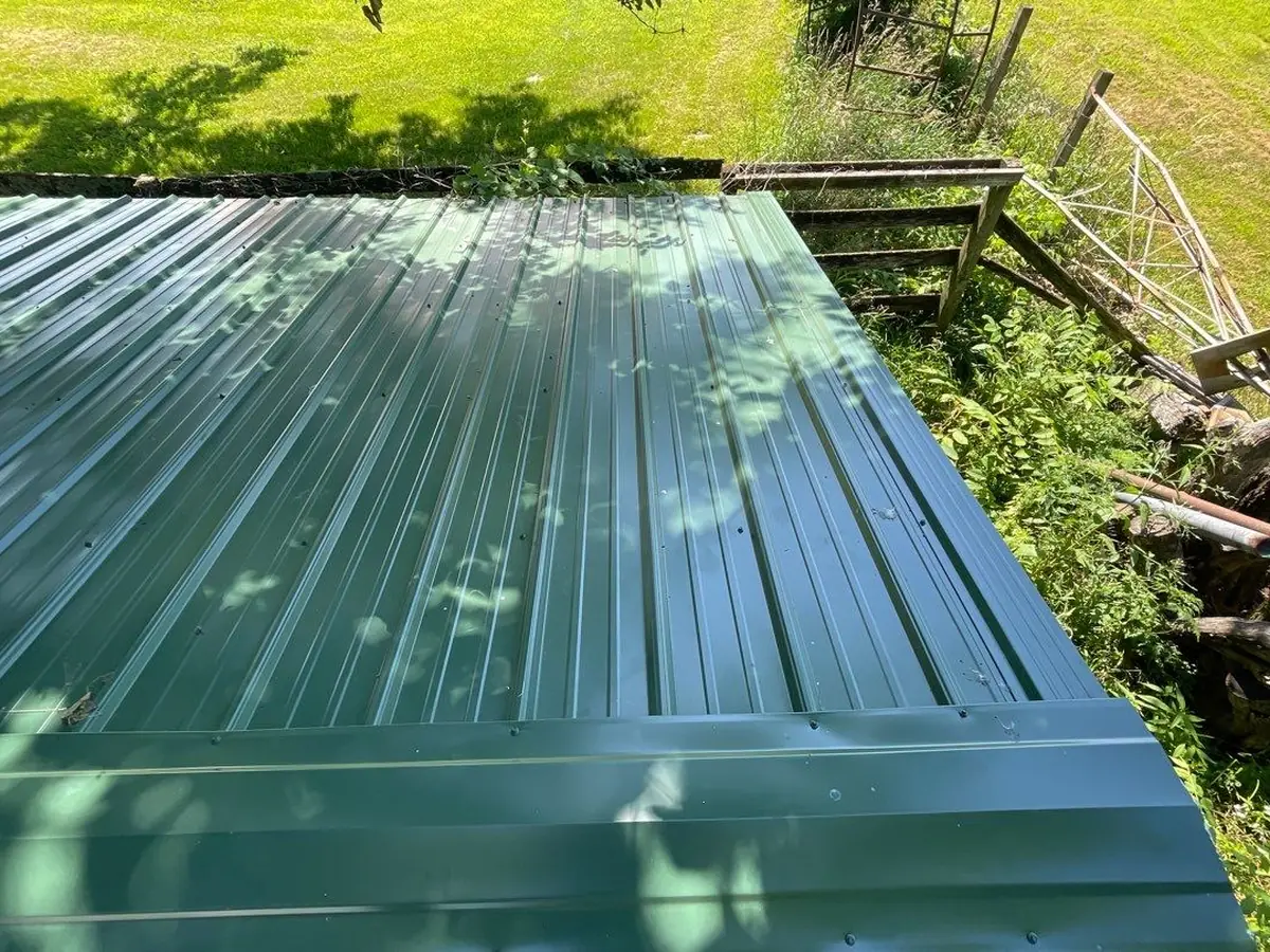 Green standing seam metal roof panels up close