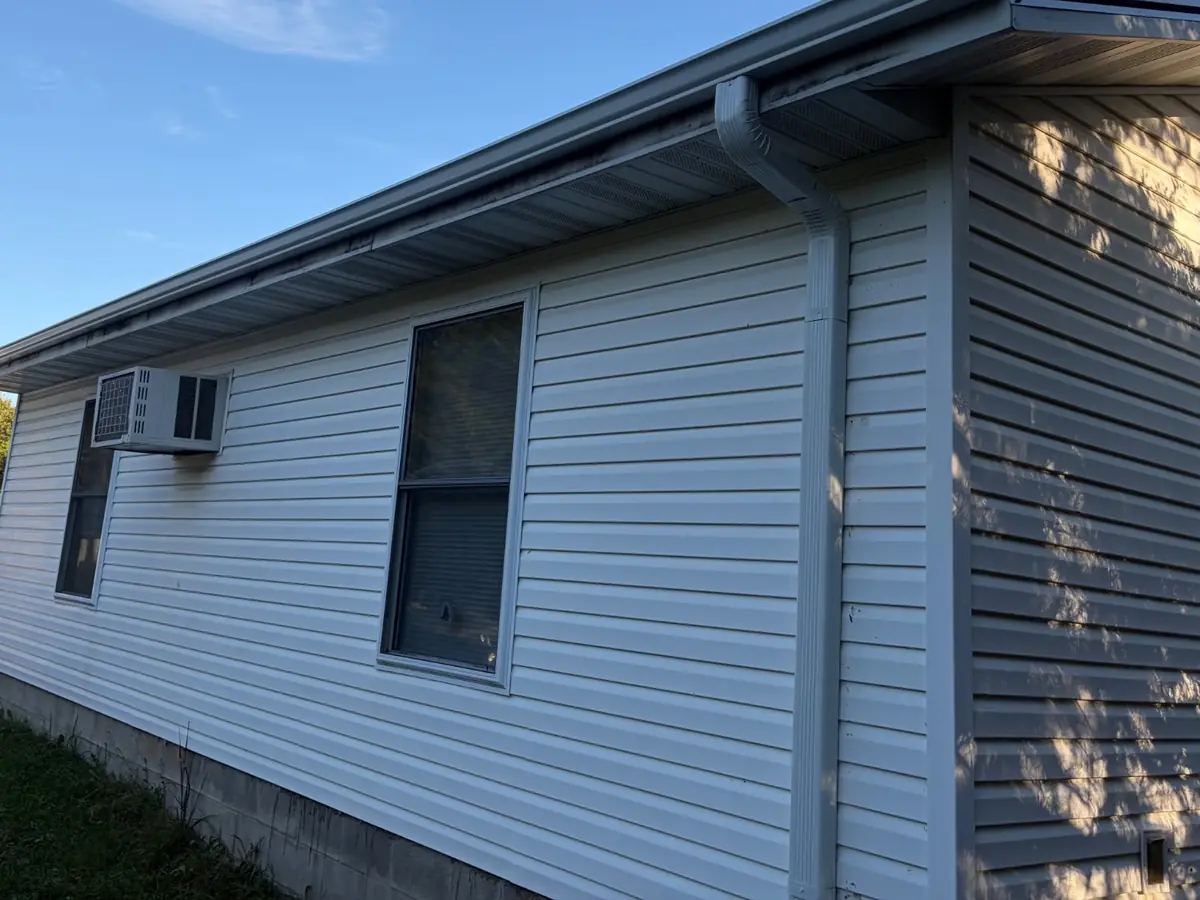 White vinyl siding, soffit and trim on the side of a Missouri home