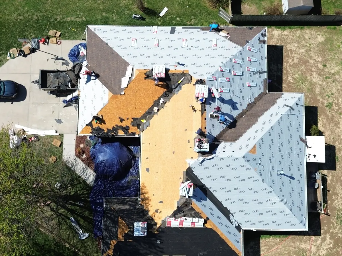Home mid roof replacement with new underlayment going down, seen from above
