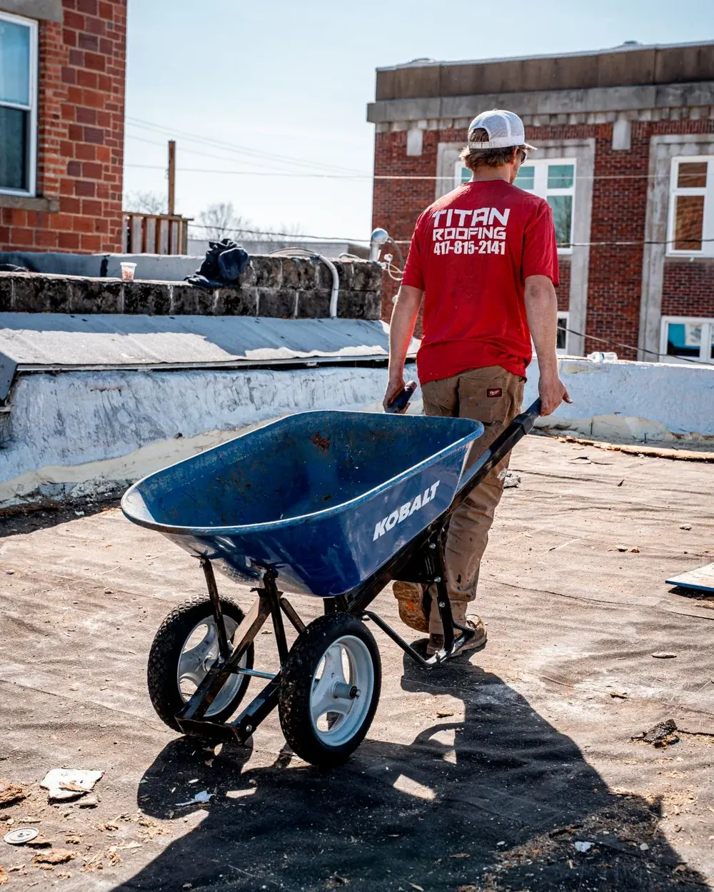 Titan crew member on a flat commercial roof