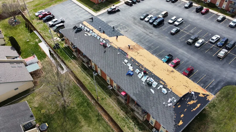 Titan crew replacing the roof on an apartment building