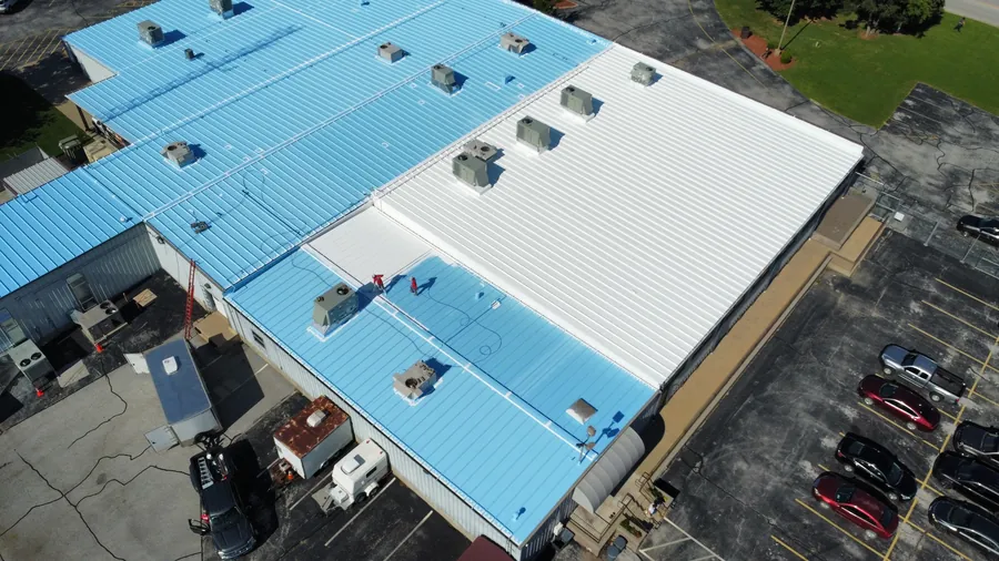 Warehouse with a newly coated metal roof, seen from above