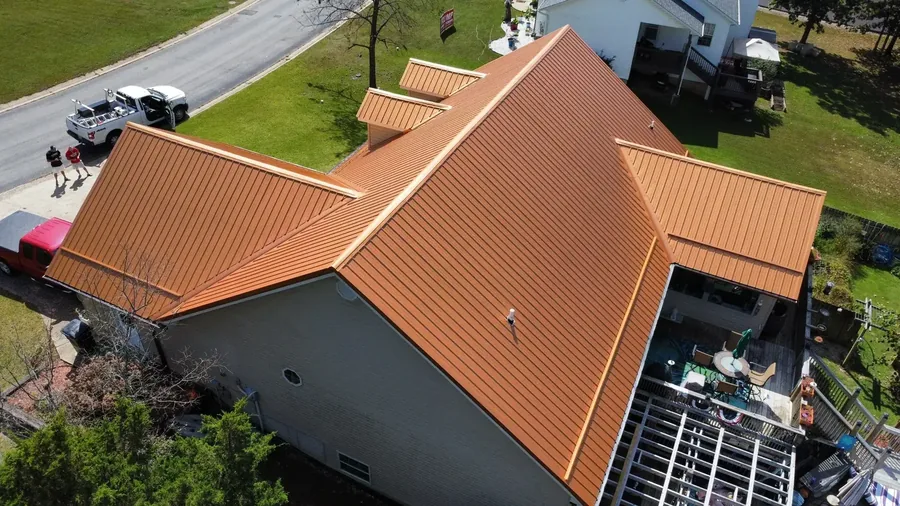 Copper-colored standing seam metal roof on a Missouri home