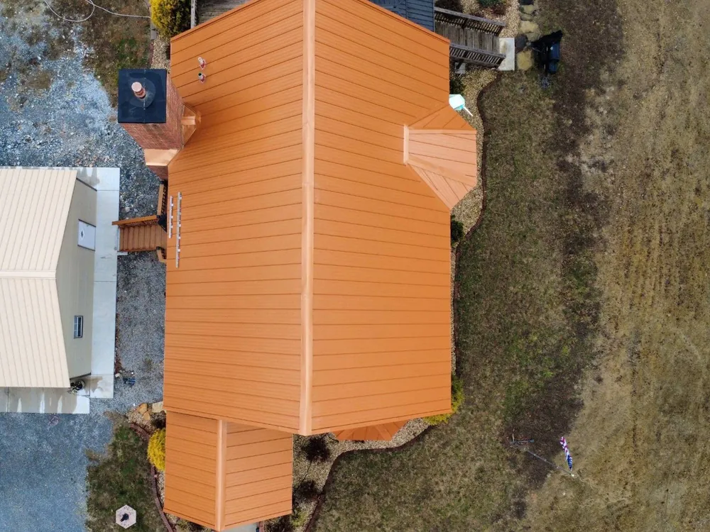 Copper-colored standing seam metal roof, seen from above