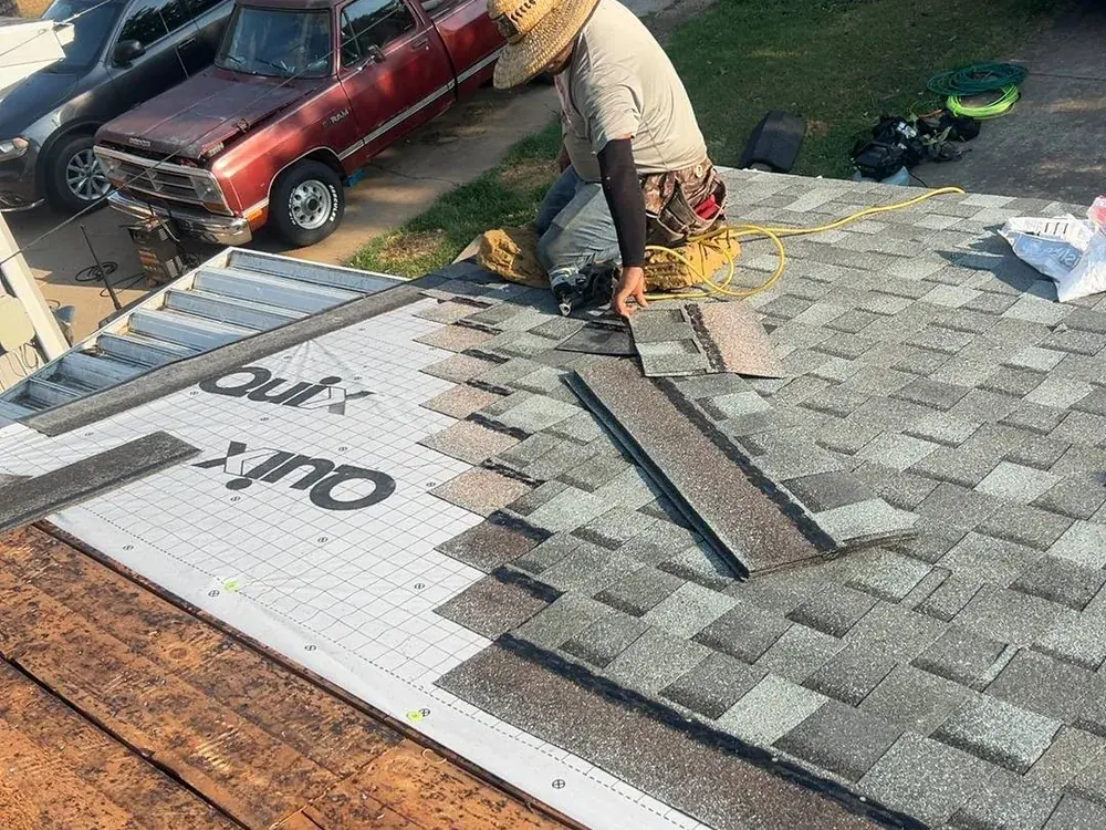 Titan roofer laying new architectural shingles on a Springfield roof