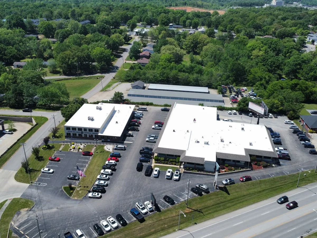 Finished white spray foam roof on a commercial complex
