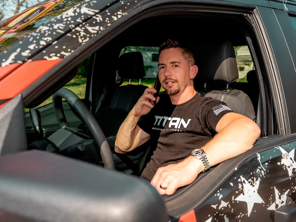 Titan representative on a call about storm damage