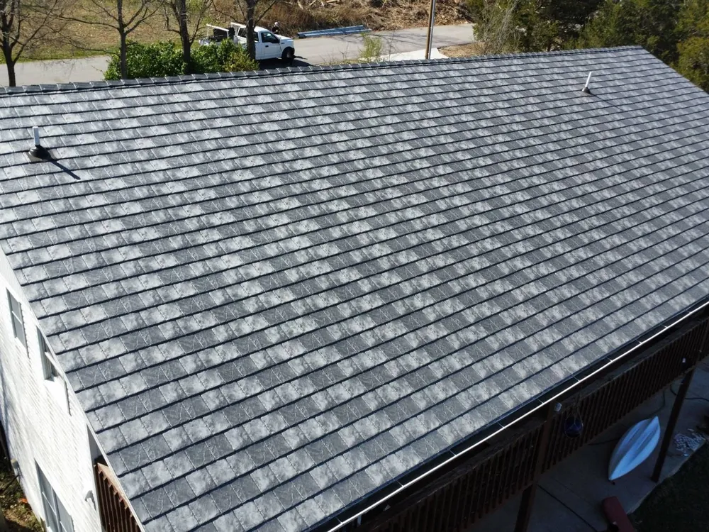 New synthetic slate roof in a blended gray on a two-story Missouri home, installed by Titan Roofing